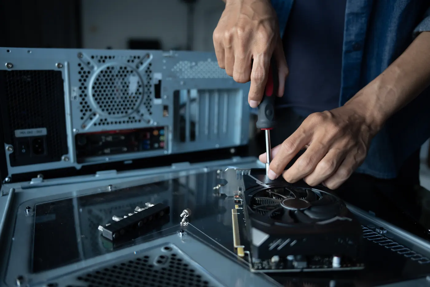 Engineer assembling computer hardware